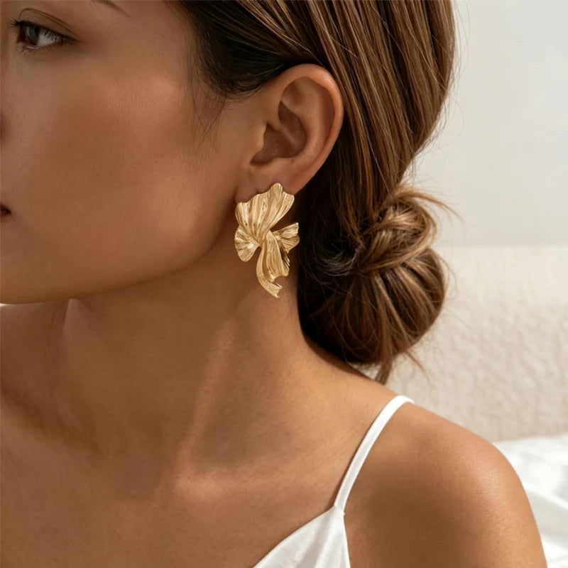 Obega Gold Abstract Wave Earrings — Textured Leaf Statement Studs