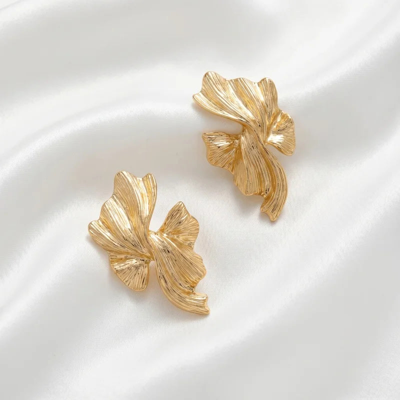 Obega Gold Abstract Wave Earrings — Textured Leaf Statement Studs