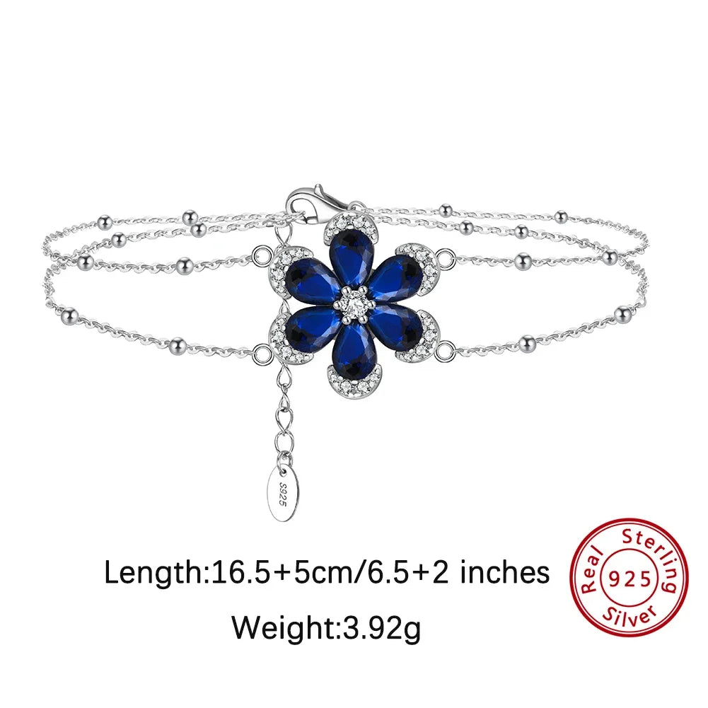 ORSA JEWELS Blue Sapphire Flower Jewelry Set — 925 Sterling Silver & Cubic Zirconia