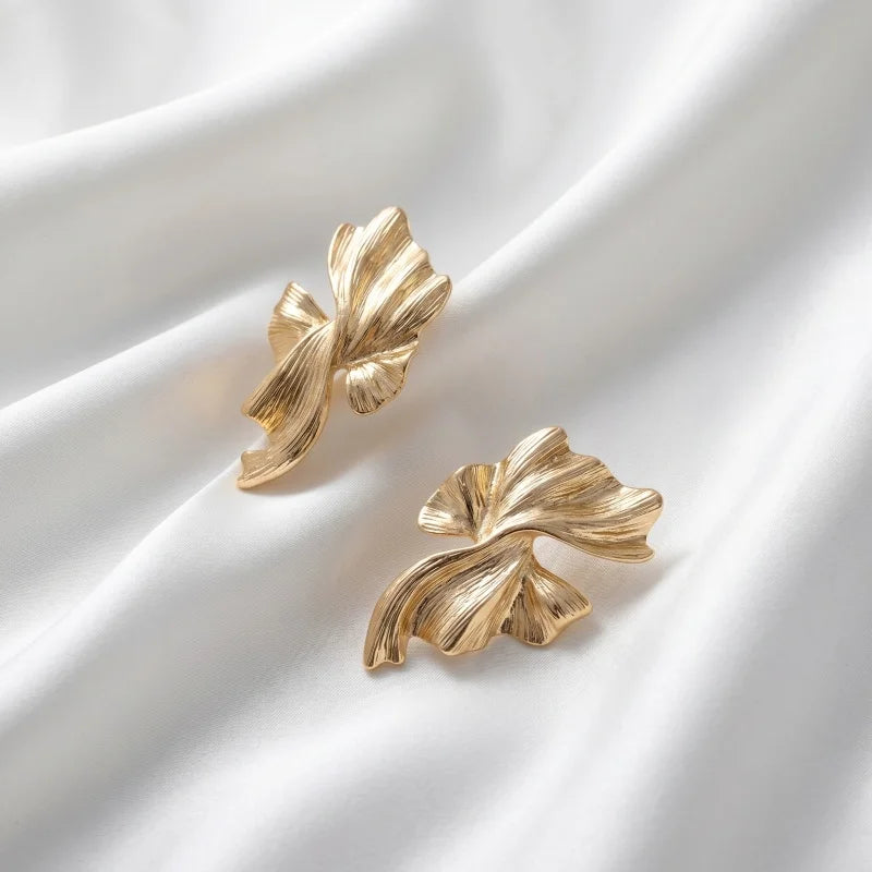 Obega Gold Abstract Wave Earrings — Textured Leaf Statement Studs