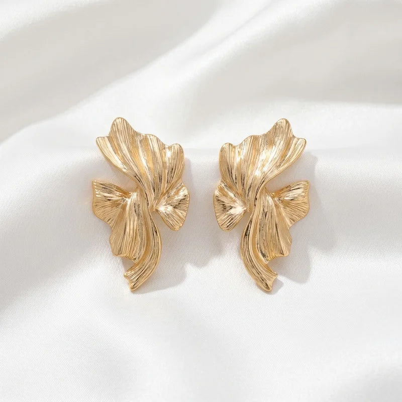 Obega Gold Abstract Wave Earrings — Textured Leaf Statement Studs